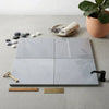 Four square gray bardiglio imperiale marble tiles with polished or honed finish arranged in a grid