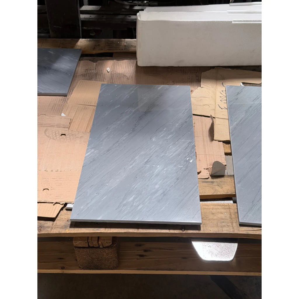 Bardiglio imperiale 12x24 polished or honed gray marble effect tiles with subtle white veining arranged on wooden pallet