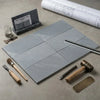 Six rectangular bardiglio imperiale gray marble tiles with subtle veining arranged in a polished or honed grid pattern