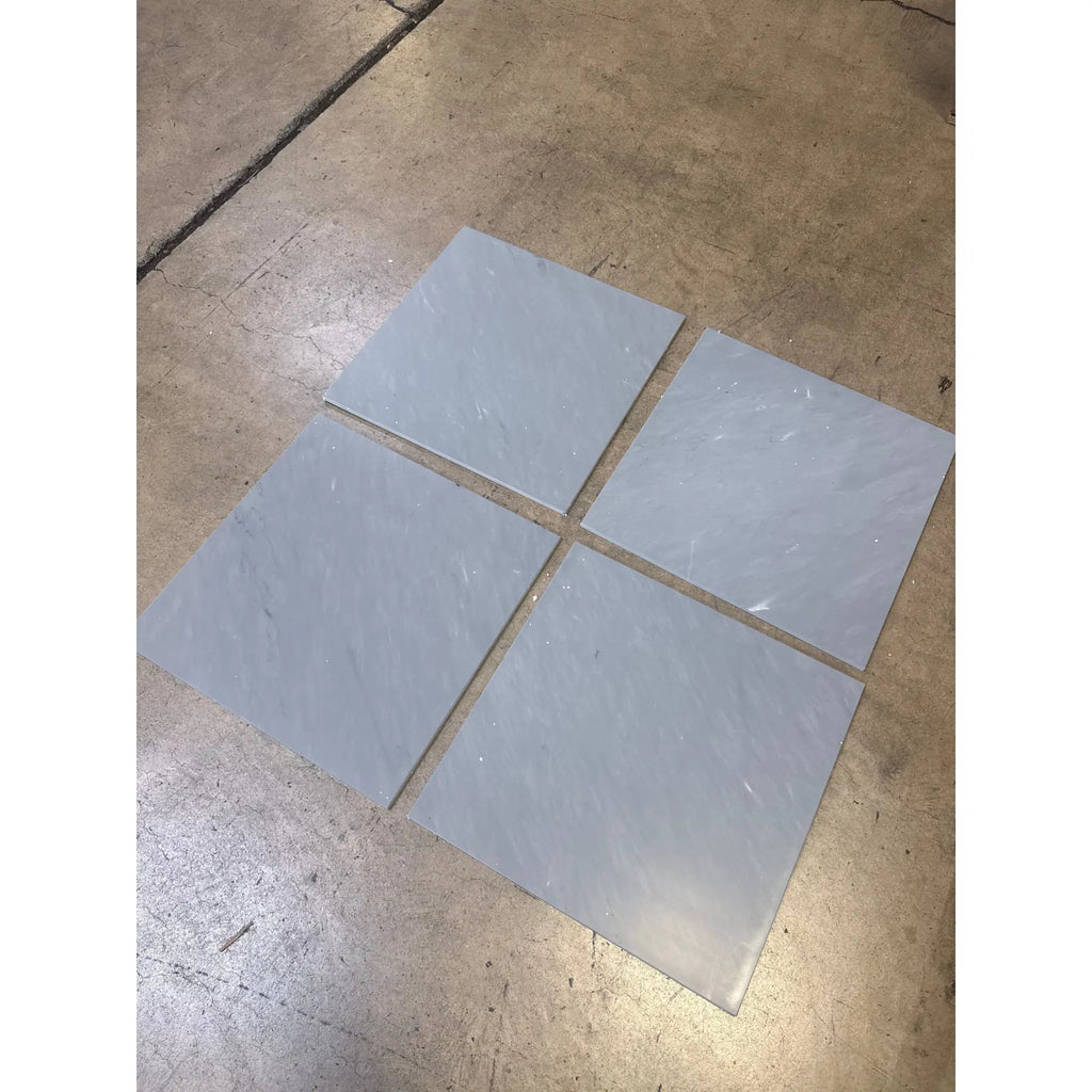 Four light gray Bardiglio Imperiale 18x18 marble tiles in polished or honed finish