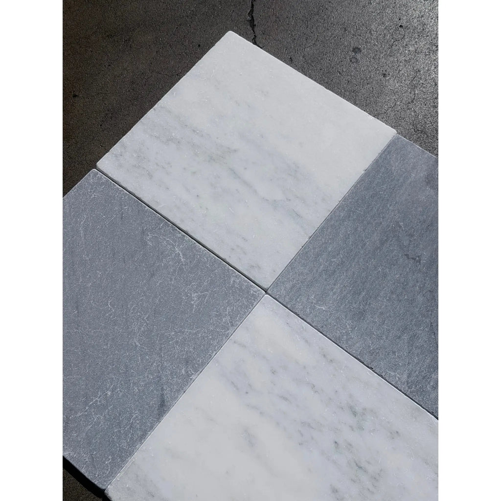 Square bardiglio imperiale 12x12 marble tumbled tiles in a checkerboard pattern of white veined and solid dark gray colors