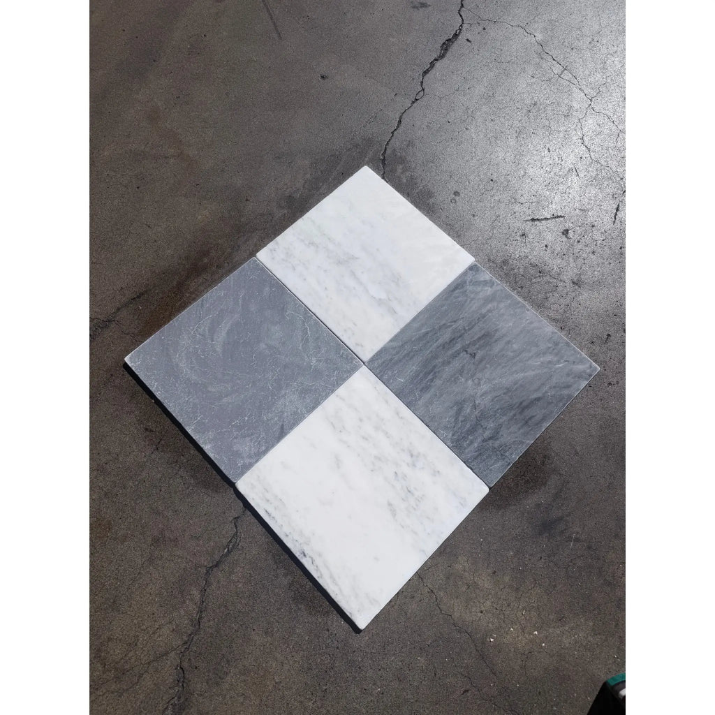 Four square bardiglio imperiale 12x12 marble tumbled tiles arranged in diamond pattern with white and gray veins
