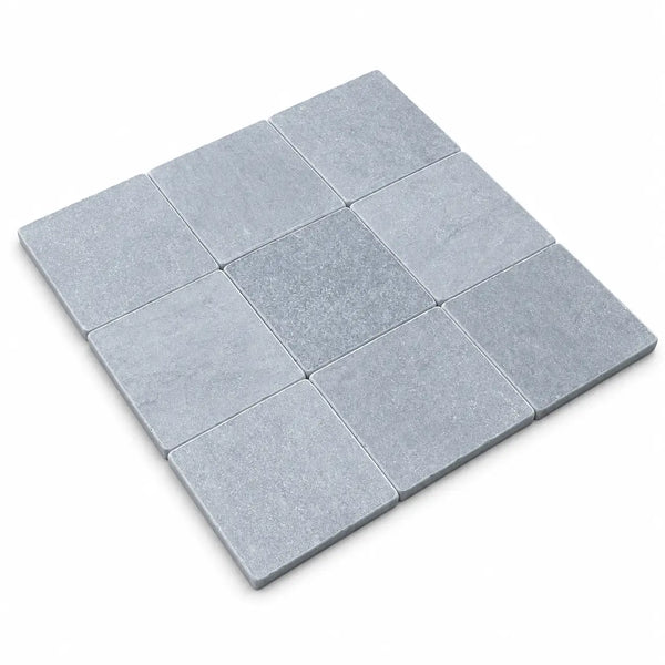 Bardiglio Imperiale 4x4 marble tumbled gray square stone tiles arranged in a precise grid pattern for flooring