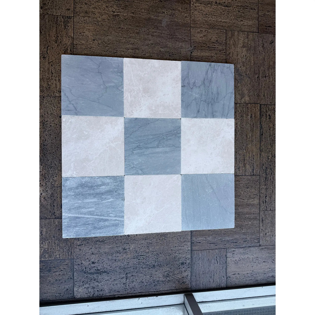 Nine square bardiglio imperiale 12x12 marble tumbled tiles in gray and white with natural veining patterns arranged in a grid