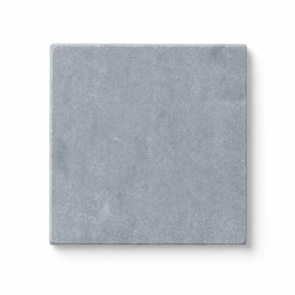 A square light gray bardiglio imperiale marble tile with a subtle textured surface in 4x4 size tumbled finish