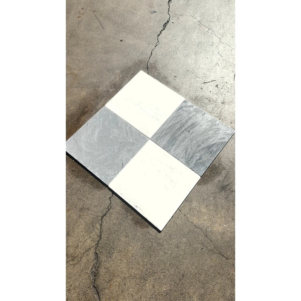 Bardiglio imperiale 12x12 marble tumbled tile with four-quadrant checkerboard pattern in white and gray marble-like surfaces