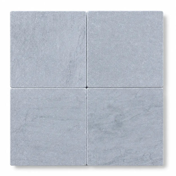 Four square gray bardiglio imperiale marble tiles with subtle veining tumbled finish 6x6 size