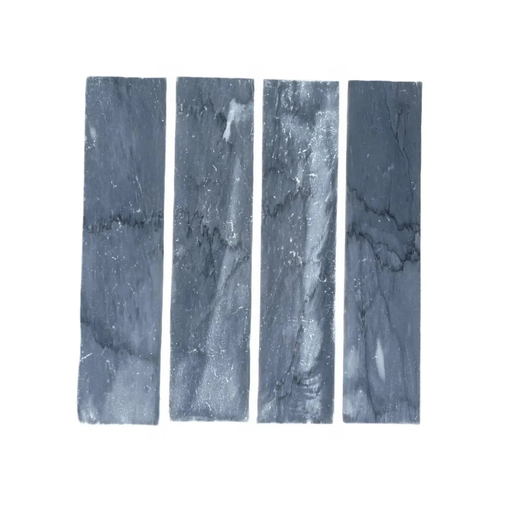 Four gray marble rectangles of Bardiglio Imperiale Marble 3’’ X 12’’ Field Tile
