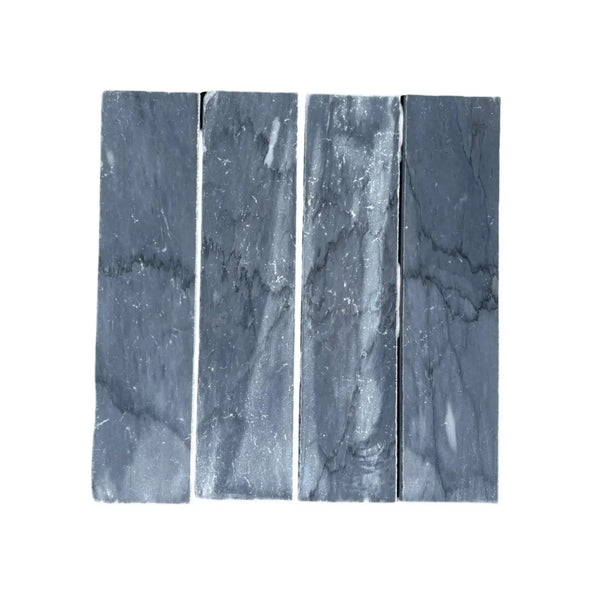 Four gray Bardiglio Imperiale Marble 3’’ X 12’’ Field Tiles arranged elegantly