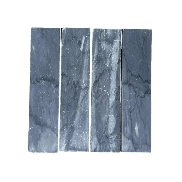 Four gray Bardiglio Imperiale Marble 3’’ X 12’’ Field Tiles arranged elegantly