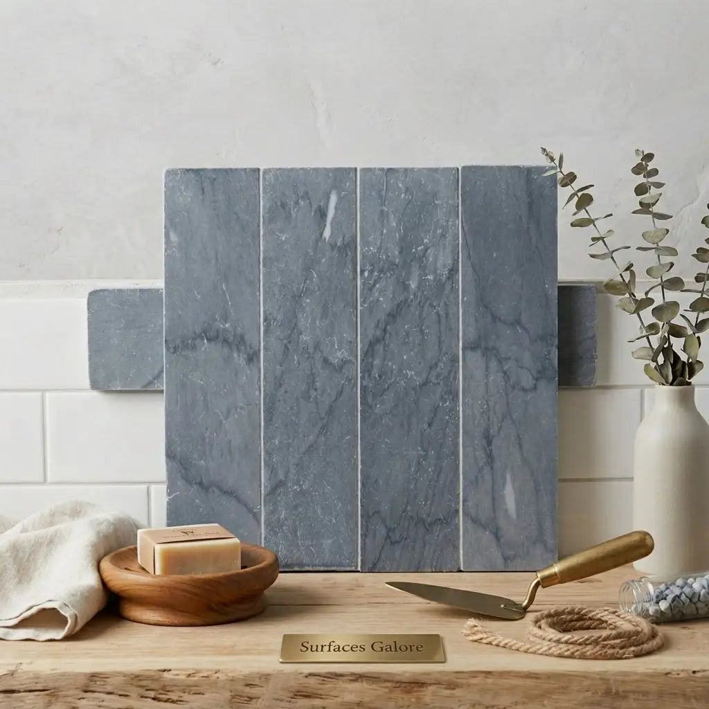 Set of four vertical bardiglio imperiale marble 3 x 12 inch field tiles in gray with subtle white veining arranged as sample display