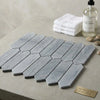 Bardiglio imperiale marble 3 x 12 picket mosaic featuring gray marble tiles with subtle veining in an interlocking hexagonal layout
