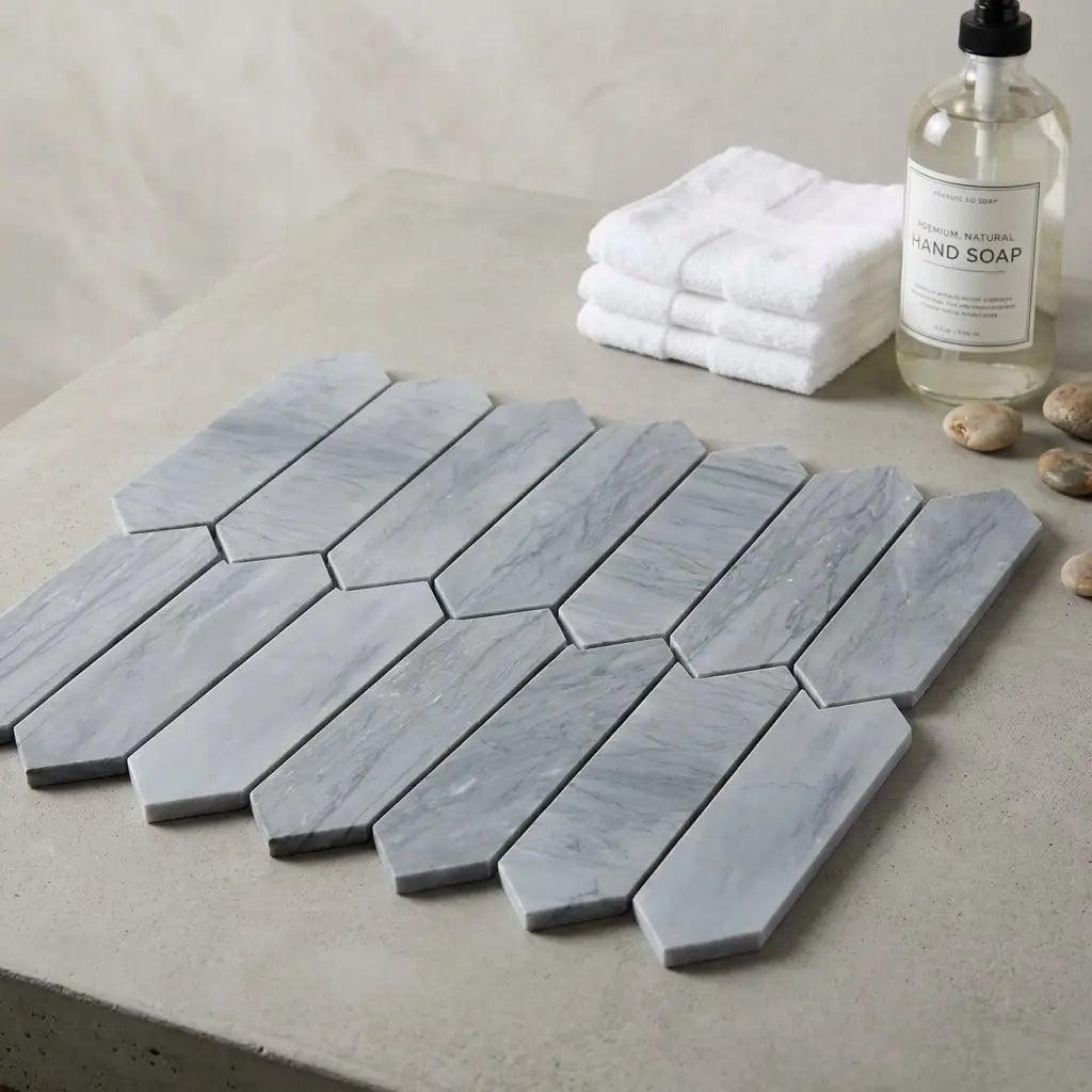 Bardiglio imperiale marble 3 x 12 picket mosaic tile in gray with subtle veining and interlocking hexagonal pattern
