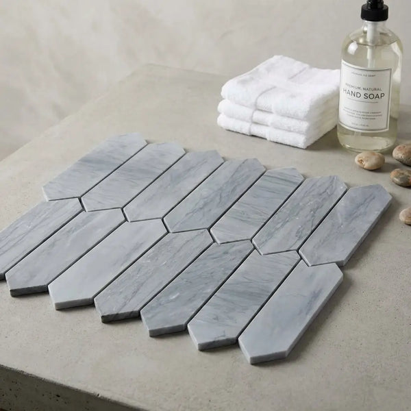 Bardiglio imperiale marble 3 x 12 picket mosaic tile in gray with subtle veining and interlocking hexagonal pattern