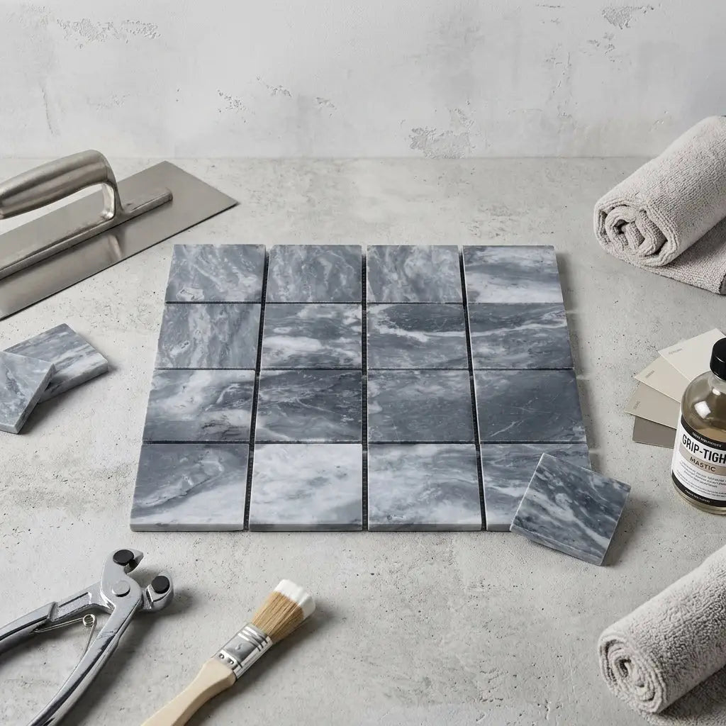 Bardiglio marble 3x3 mosaic tiles featuring gray marble with swirling white veining arranged in a grid pattern