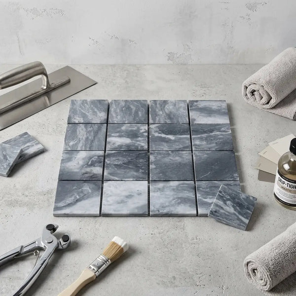Bardiglio marble 3x3 mosaic tiles featuring gray marble with swirling white veining arranged in a grid pattern