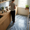 Gray bardiglio nuvolato 12x24 marble polished countertop with wooden cabinets and sink in kitchen setting