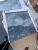 Dark gray Bardiglio Nuvolato marble-look floor tile with white veining in 24x24 size