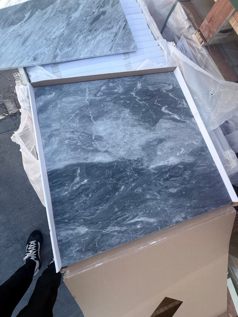 Dark gray Bardiglio Nuvolato marble-look floor tile with white veining in 24x24 size