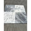 Four square Bardiglio Nuvolato marble tiles with white and gray veining patterns