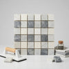 A square mosaic tile panel of bardiglio nuvolato thassos oriental white polished marble in white and gray tones