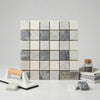 A square mosaic tile panel with a white and gray bardiglio nuvolato marble checker pattern polished or honed finish