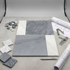 Gray and white marble tile samples in bari bardiglio imperiale 12x12 and carrara white 4x12 arranged geometrically
