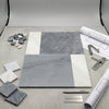 Gray and white marble tile samples arranged in geometric pattern bari in bardiglio imperiale 12x12 and carrara white 4x12 set