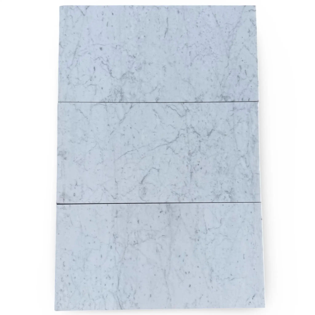 Three marble tiles comprising Bari in Rosso Levanto and Carrara White set