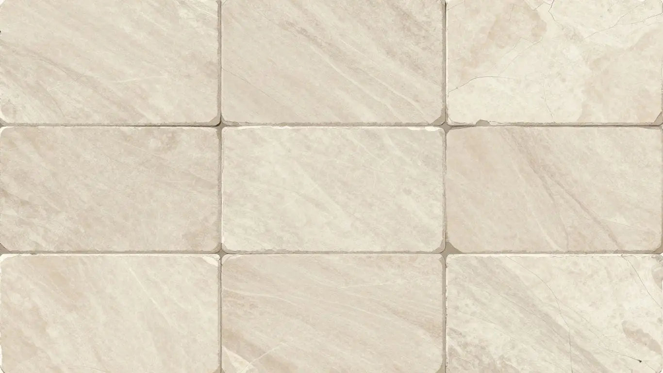 Light limestone tiles with natural veining and matte finish.