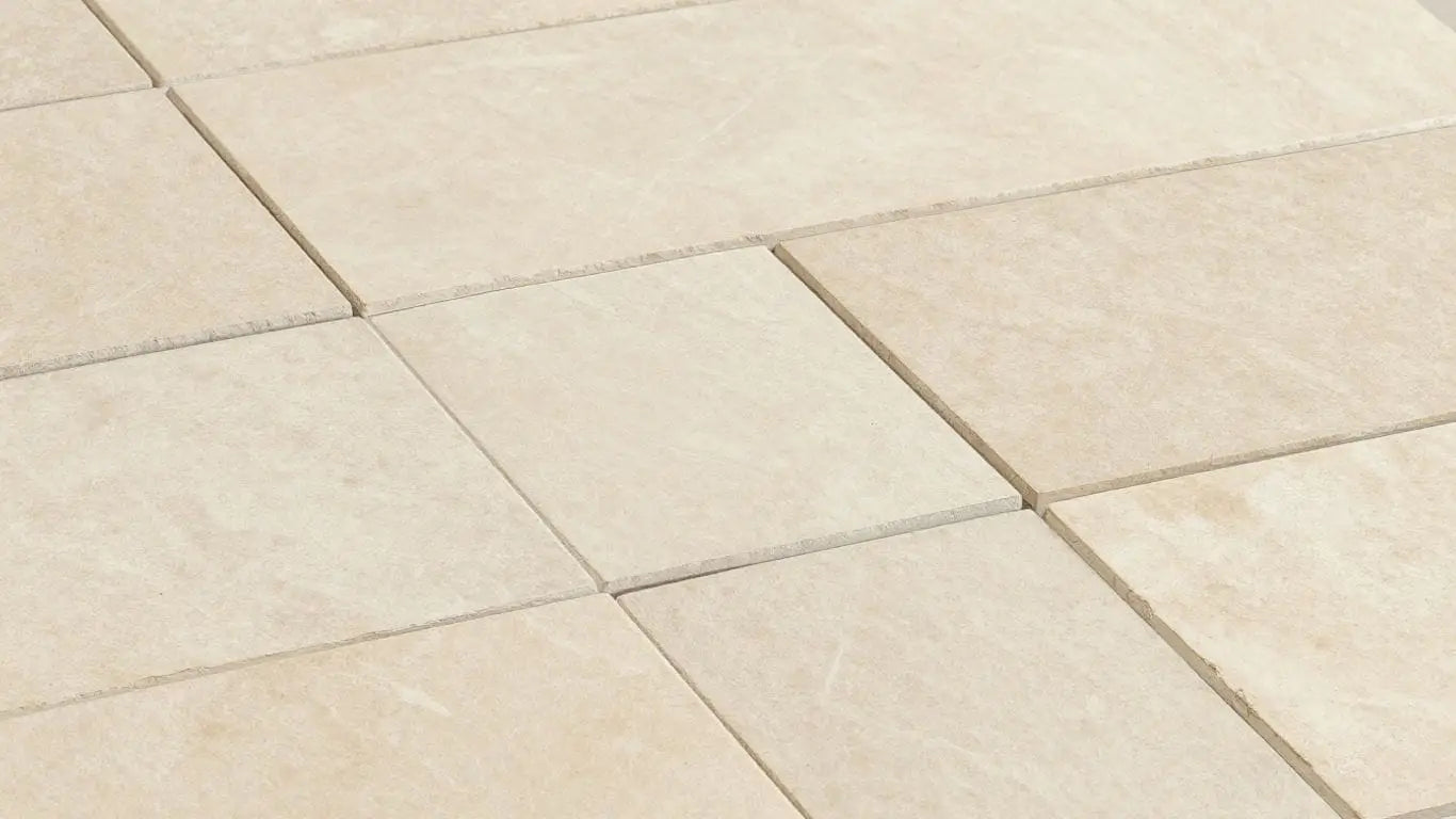 Perlino Crema limestone tiles with warm beige tones and subtle veining.