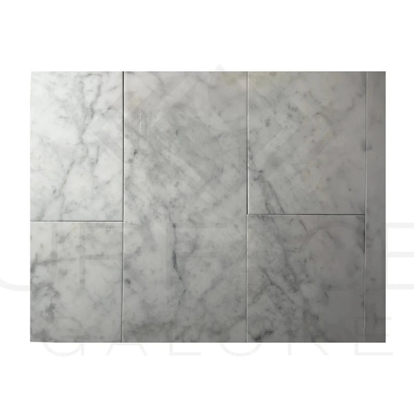 Marble tile arrangement featuring Bianco Carrara 12X24 Polished Marble Tile