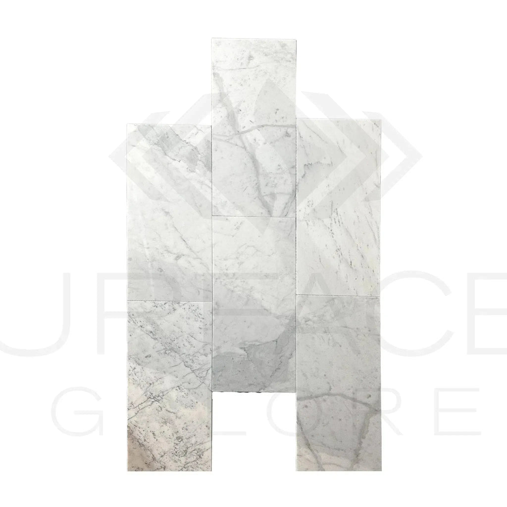 Carrara marble tile arrangement featuring Bianco Carrara Standard polished tiles