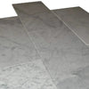 Marble-patterned Bianco Carrara Standard 12X24 Polished Marble Tile in a stylish display