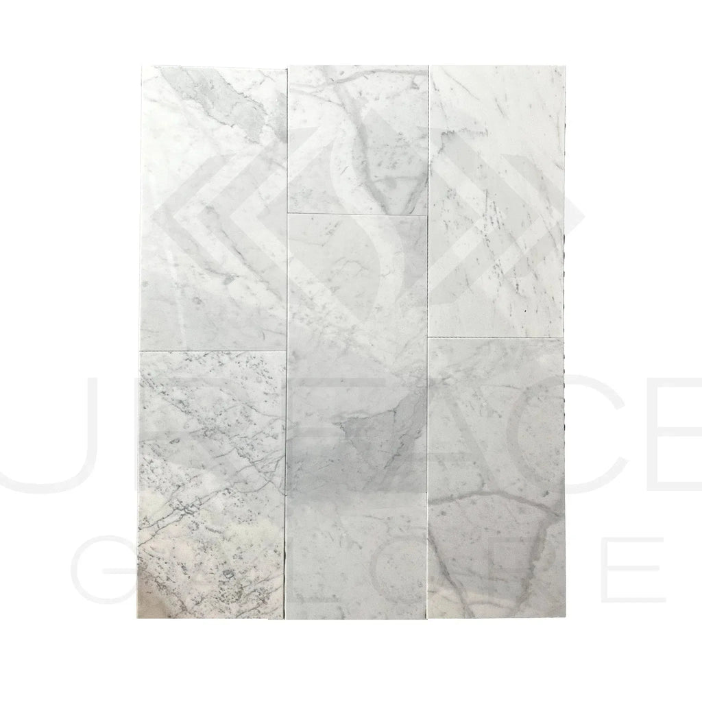 White marble tile arrangement of Bianco Carrara Standard polished tile, 12x24 inches