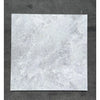 Square marble tile from the Bianco Congelato 4 3/4X12 Baseboard Trim Dolomite Leathered