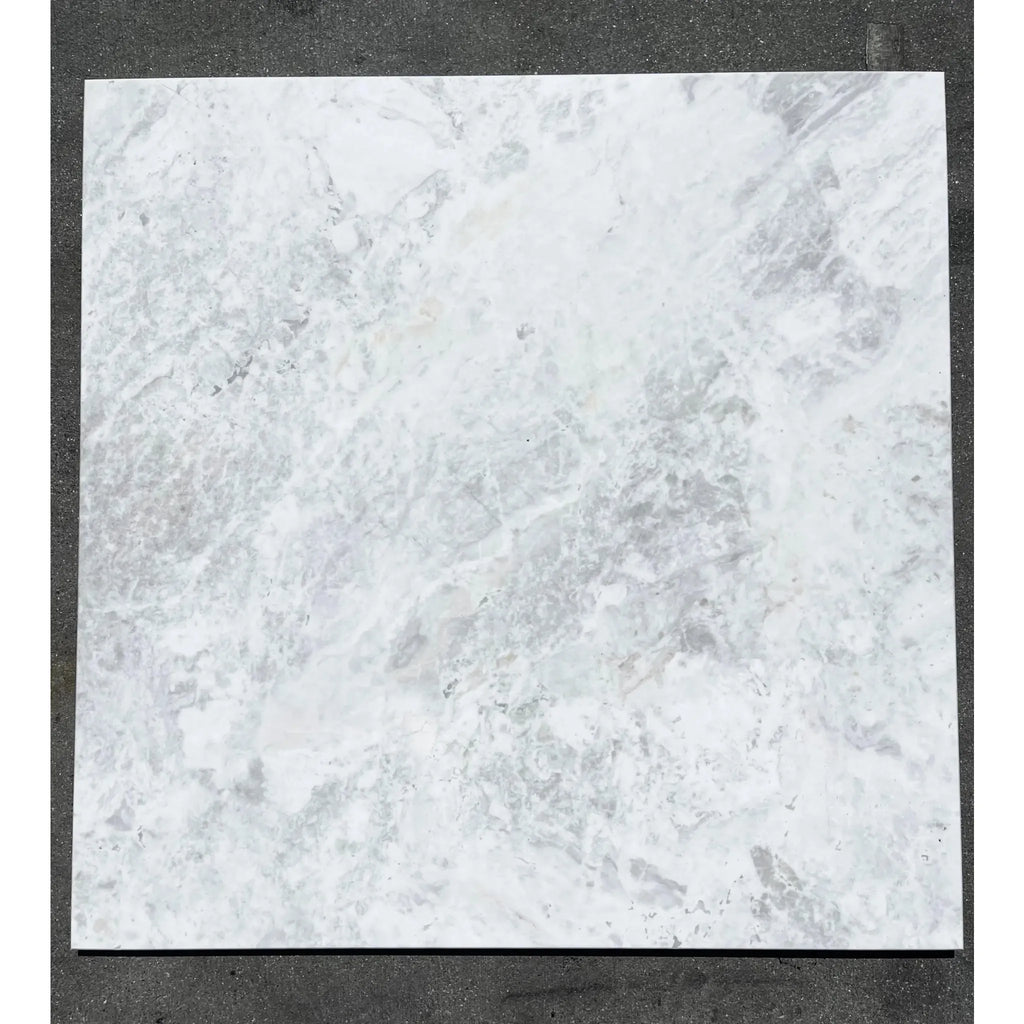 Square marble tile with gray veining from Bianco Congelato 6X12 Dolomite Leathered