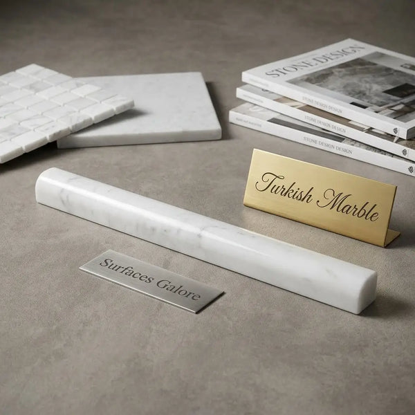 A sleek white turkish marble nameplate with gray veining and polished finish in bianco dolomite pencil liner style