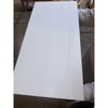 A person holding a smooth glossy white rectangular Bianco Dolomite marble panel polished or honed 12x24 inches