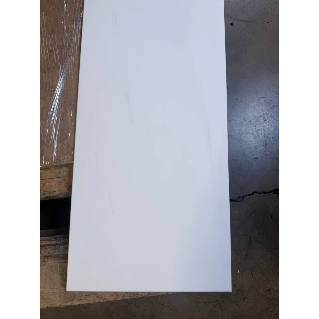 White rectangular bianco dolomite 12x24 marble panel with a smooth glossy polished finish