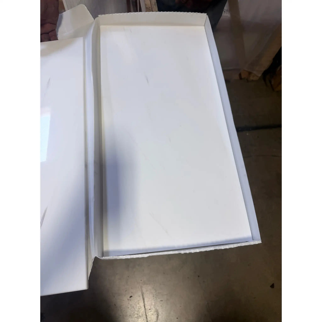 White rectangular box showing slightly textured interior surface of bianco dolomite 12x24 marble polished or honed tile