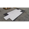 White Bianco Dolomite marble slab in flat lay on black plastic sheet