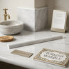 White turkish marble rolling pin with subtle gray veining featuring polished bianco dolomite quarter-round trim liner