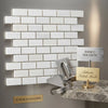 White rectangular bianco dolomite polished marble mosaic tiles arranged in a 1x2 brick pattern