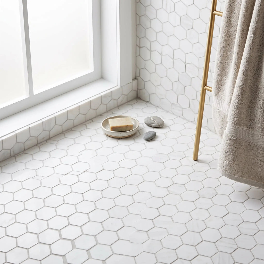 Bianco dolomite 2 inch hexagon mosaic marble floor tile in white with subtle gray grout lines polished or honed finish