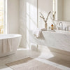 White marble bathroom vanity with integrated sink and chrome faucet made of bianco dolomite 24x24 polished or honed