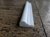 White plastic door threshold strip with Bianco Dolomite marble profile