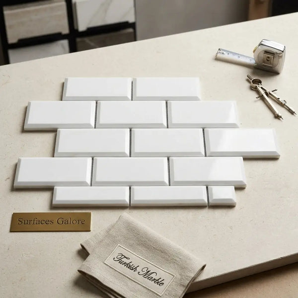White rectangular bianco dolomite marble subway tiles arranged in a deep-beveled 2x4 brick pattern polished-honed