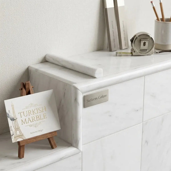 Bianco dolomite 3/4x12 bullnose liner marble polished with white turkish marble and subtle gray veining on countertop