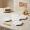White hexagonal marble coasters in bianco dolomite with subtle veining polished or honed finish